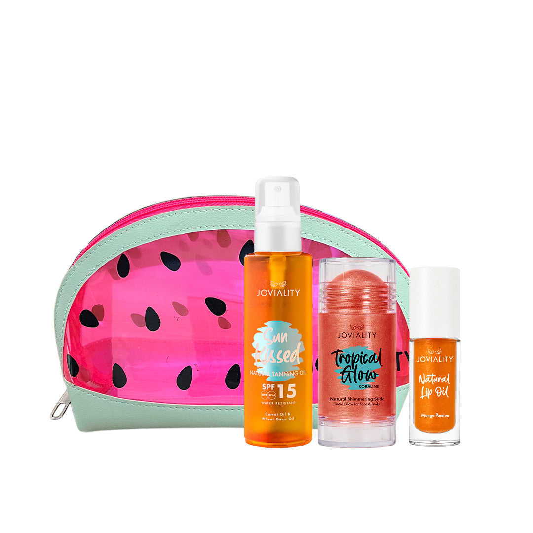 A Joviality self-care summer 
gift set featuring a watermelon-patterned zippered pouch, an orange body spray bottle tanning oil sunkissed dry oil, a pink shimmering balm balm stick, and an orange shimmering mango natural lip oil, arranged on a white background.