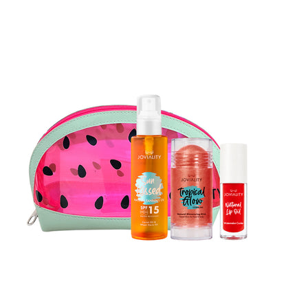 A Joviality self-care summer gift set featuring a watermelon-patterned zippered pouch, an sunkissed tanning dry oil orange body spray bottle, a coral tropical glow balm stick, and a red natural lip oil watermelon flavor, arranged on a white background.